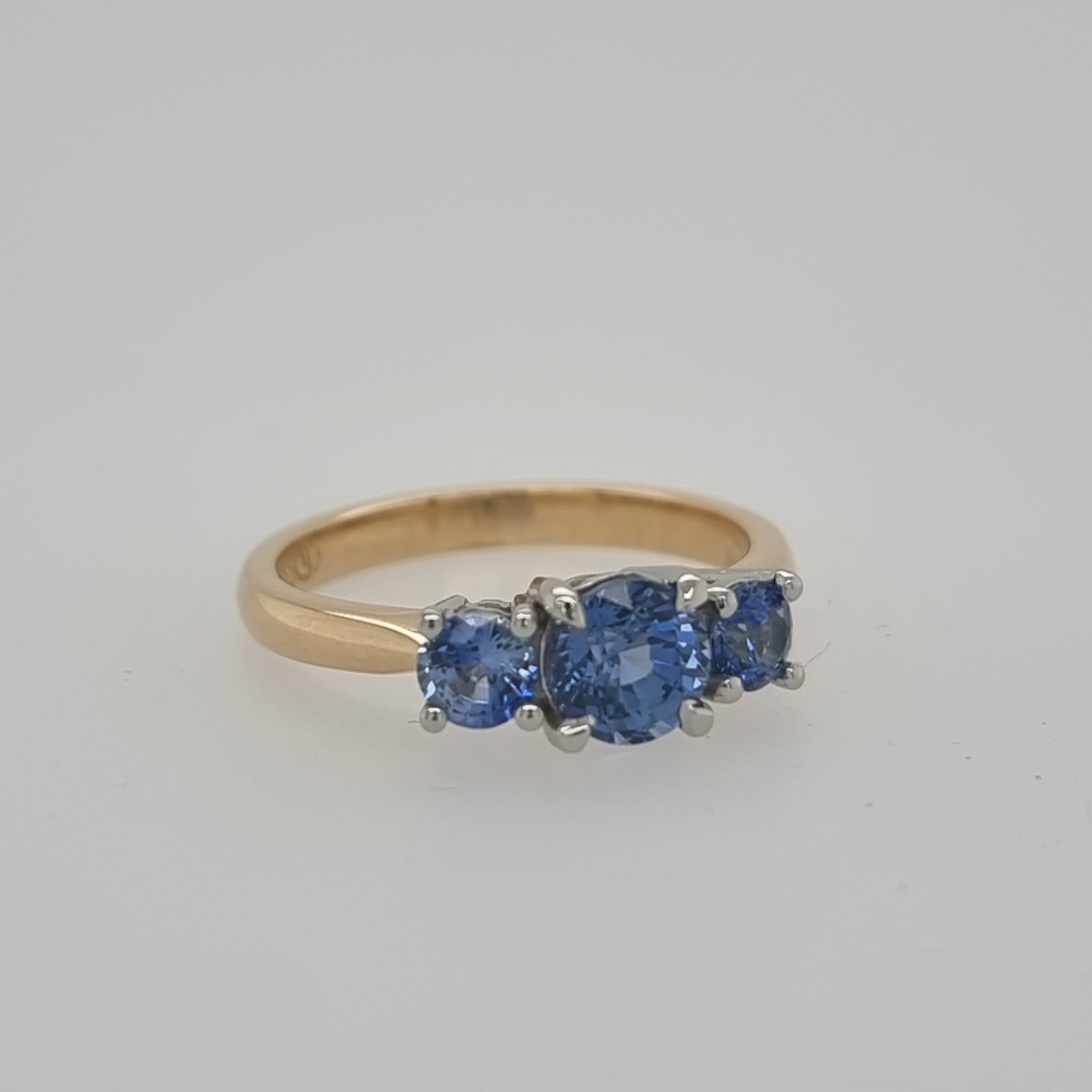 Yellow and White Gold Blue Sapphire Trilogy Ring